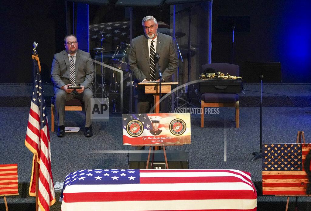 Jonah Hinebaugh Gov. Eric Holcomb speaks to those attending the funeral service for Marine Cpl. Humberto Sanchez at LifeGate Church in Logansport, Ind., on Tuesday, Sept. 14, 2021. Sanchez was one of 13 U.S. service members killed in last month's suicide bombing at Afghanistan’s Kabul airport during the U.S.-led evacuation. (Jonah Hinebaugh/The Pharos-Tribune via AP)