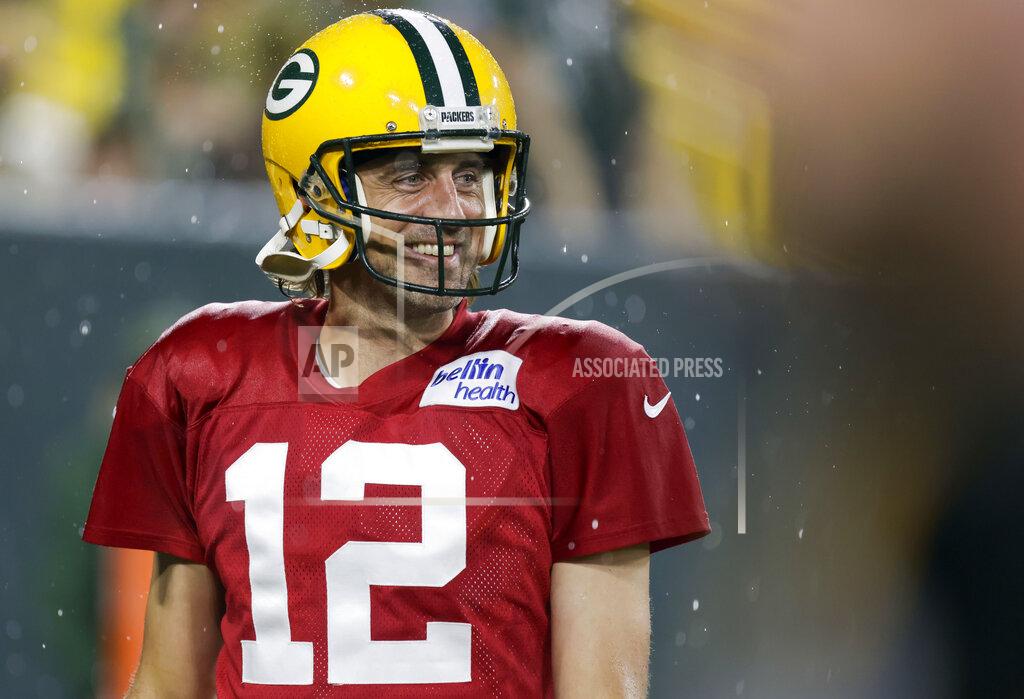 Matt Ludtke Green Bay Packers quarterback Aaron Rodgers smiles as he walks off the field during NFL football training camp at Lambeau Field on Saturday, Aug. 7, 2021, in Green Bay, Wis. (AP Photo/Matt Ludtke)