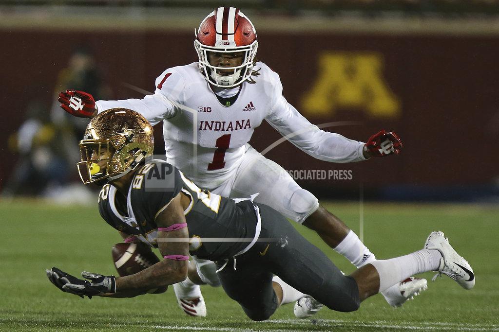 Stacy Bengs Minnesota wide receiver Demetrius Douglas tries to catch a ball as it slips through his arms against Indiana's Juwan Burgess during an NCAA college football game Friday, Oct. 26, 2018, in Minneapolis. Minnesota won 38-31. (AP Photo/Stacy Bengs)