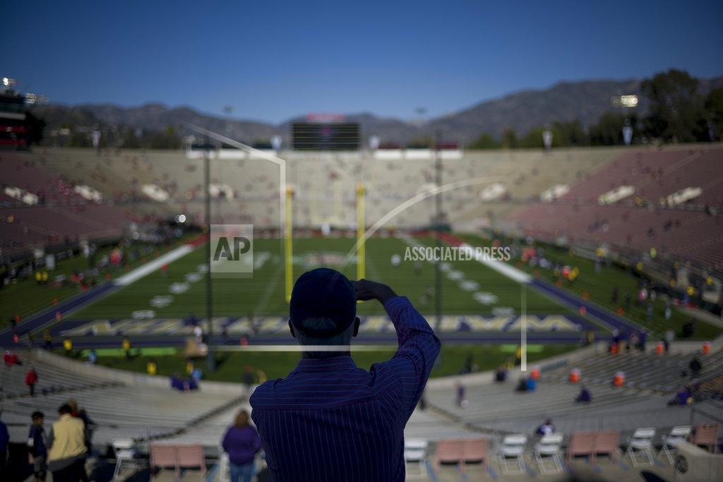 Jae C. Hong A fan arrives before the Rose Bowl NCAA college football game between Ohio State and Washington Tuesday, Jan. 1, 2019, in Pasadena, Calif. (AP Photo/Jae C. Hong)