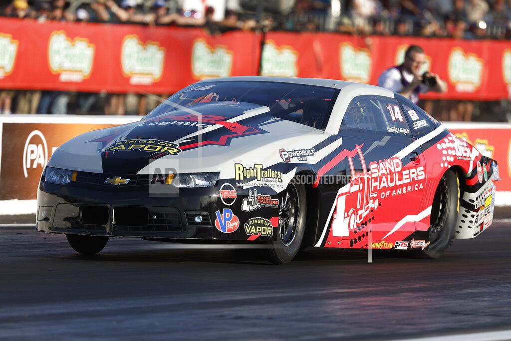 Randy Anderson In this photo provided by the NHRA, Camrie Caruso drives in Pro Stock qualifying Friday, April 22, 2022, during the NHRA SpringNationals drag races at Houston Raceway Park in Baytown, Texas. (Randy Anderson/NHRA via AP)