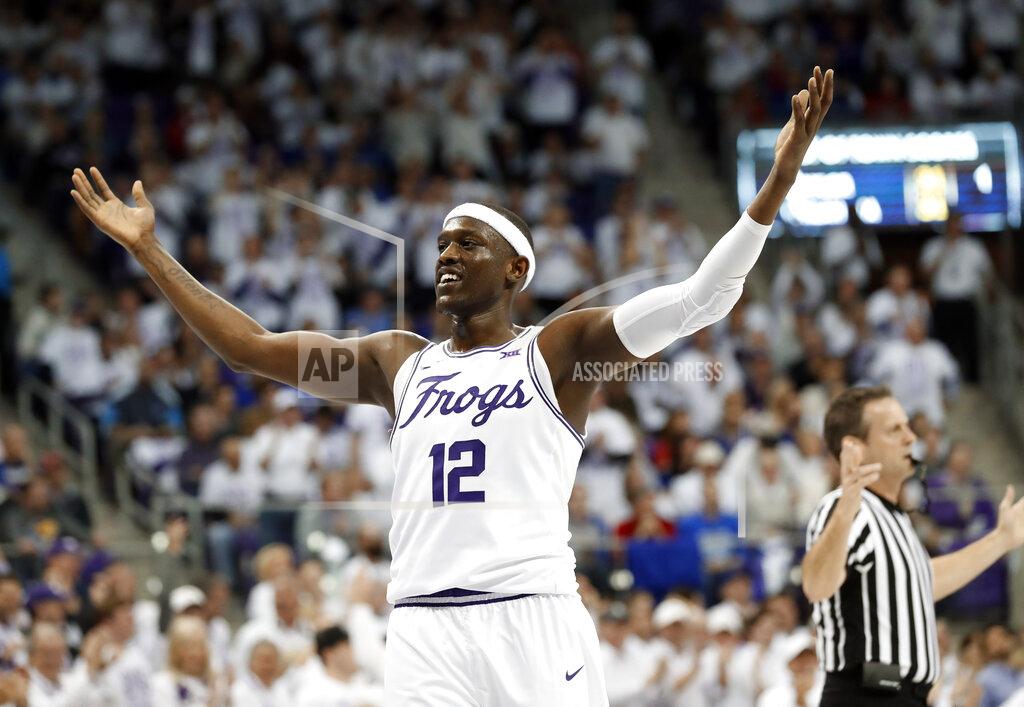 Tony Gutierrez TCU forward Kouat Noi (12) celebrates sinking a three-point basket against Kansas in the first half of an NCAA college basketball game in Fort Worth, Texas, Monday, Feb. 11, 2019. (AP Photo/Tony Gutierrez)