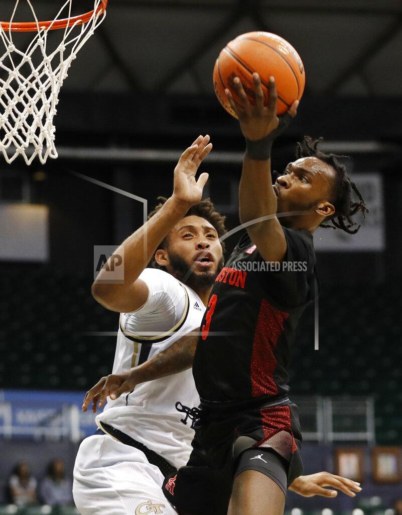 Marco Garcia Houston guard DeJon Jarreau (3) shoots next to Georgia Tech forward James Banks III during the first half of an NCAA college basketball game Monday, Dec. 23, 2019, in Honolulu. (AP Photo/Marco Garcia)