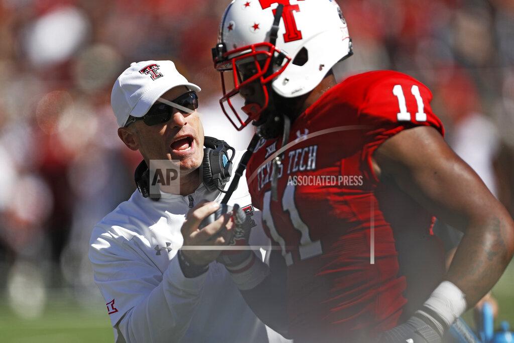 Brad Tollefson Texas Tech coach Matt Wells talks to Donta Thompson (11) during the second half of an NCAA college football game against Iowa State, Saturday, Oct. 19, 2019, in Lubbock, Texas. (Brad Tollefson/Lubbock Avalanche-Journal via AP)