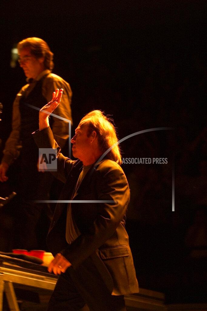 Matt Rainey FILE - In this Aug. 12, 1999 file photo, Danny Federici waves to the crowd as he takes the stage with Bruce Springsteen and the E Street band in East Rutherford, N.J. Federici, a longtime keyboard player for Springsteen, died on April 17, 2008 at 58. (Matt Rainey/NJ Advance Media via AP, File)