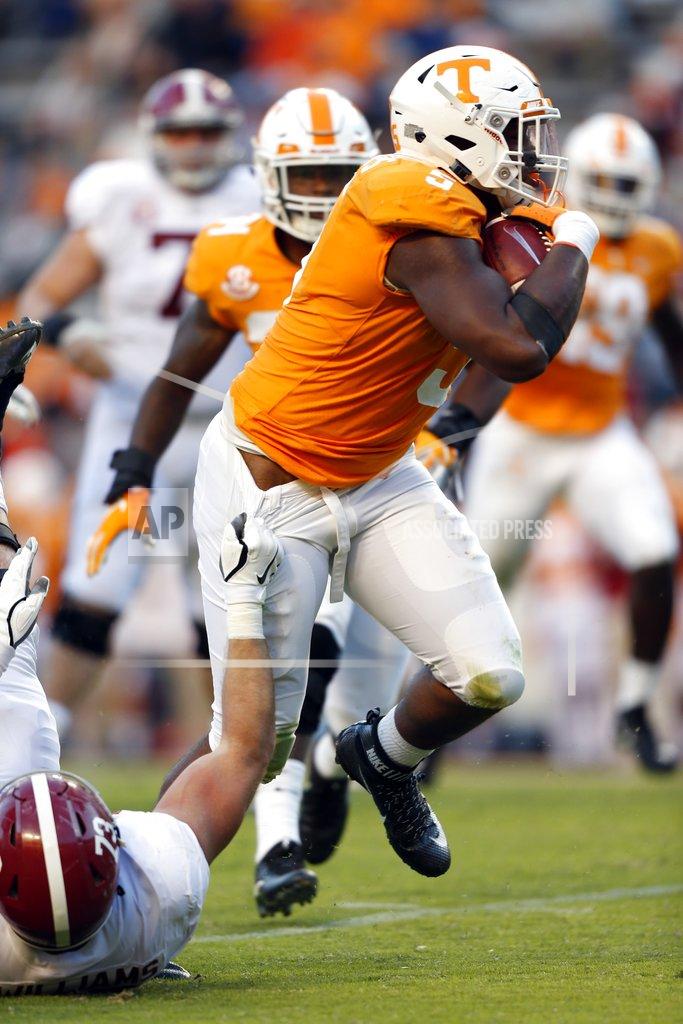 Wade Payne Tennessee defensive lineman Kyle Phillips (5) runs back an interception as Alabama offensive lineman Jonah Williams (73) tries to tackle him in the second half of an NCAA college football game Saturday, Oct. 20, 2018, in Knoxville, Tenn. Alabama won 58-21. (AP Photo/Wade Payne)