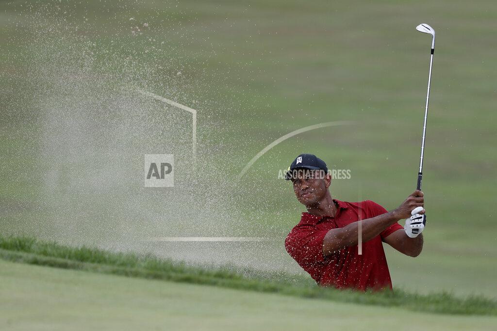 Darron Cummings Tiger Woods hits from a bunker toward the 18th green during the final round of the Memorial golf tournament, Sunday, July 19, 2020, in Dublin, Ohio. (AP Photo/Darron Cummings)