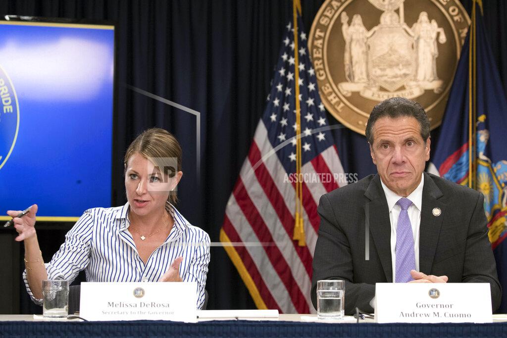 Mary Altaffer FILE — In this Sept. 14, 2018 file photo, Secretary to the Governor Melissa DeRosa, is joined by New York Gov. Andrew Cuomo as she speaks to reporters during a news conference, in New York. Top aides to Cuomo altered a state Health Department report to obscure the true number of people killed by COVID-19 in the state's nursing homes, The Wall Street Journal and The New York Times reported late Thursday, March 4, 2021. The aides, including DeRosa, pushed state health officials to edit the July report so only residents who died inside long-term care facilities, and not those who became ill there and later died at a hospital, were counted, the newspapers reported.(AP Photo/Mary Altaffer, File)