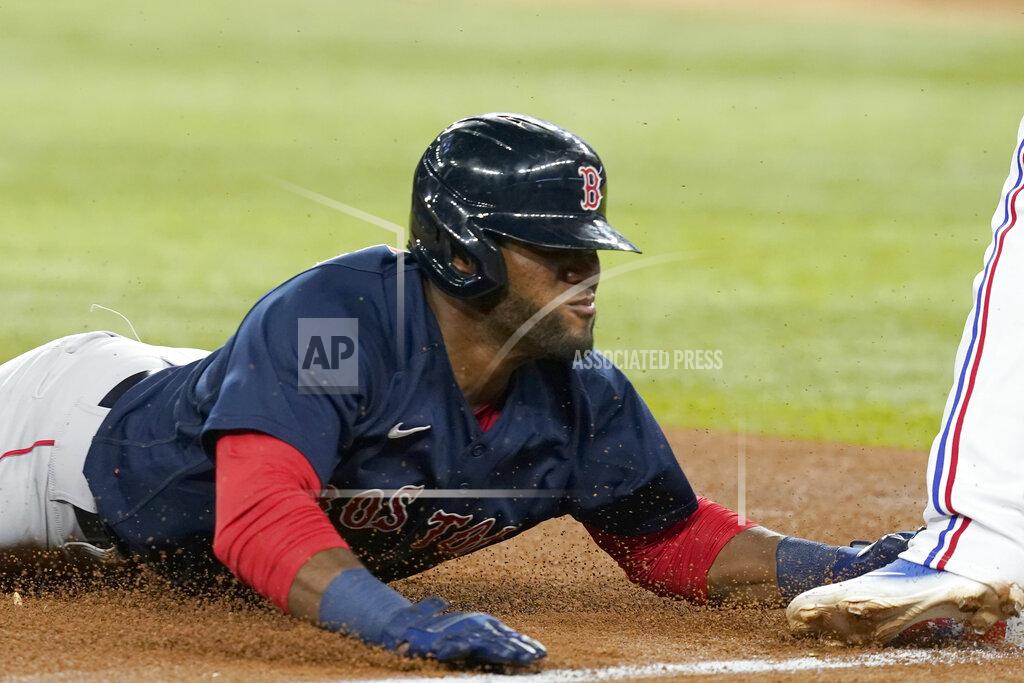Lm Otero Boston Red Sox's Franchy Cordero slides safely into third base, advancing from second on a wild pitch by the Texas Rangers during the sixth inning of a baseball game in Arlington, Texas, Friday, May 13, 2022. (AP Photo/LM Otero)