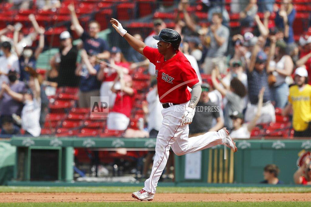 Michael Dwyer Boston Red Sox's Rafael Devers rounds the bases on his three-run home run during the fifth inning of a baseball game against the Los Angeles Angels, Sunday, May 16, 2021, in Boston. (AP Photo/Michael Dwyer)