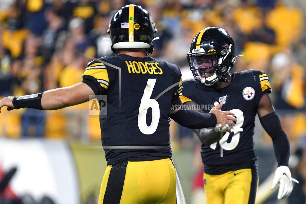 Barry Reeger Pittsburgh Steelers quarterback Devlin Hodges (6) celebrates with wide receiver James Washington (13) after throwing him a touchdown pass in the second half of a preseason NFL football game against the Kansas City Chiefs, Saturday, Aug. 17, 2019, in Pittsburgh. (AP Photo/Barry Reeger)