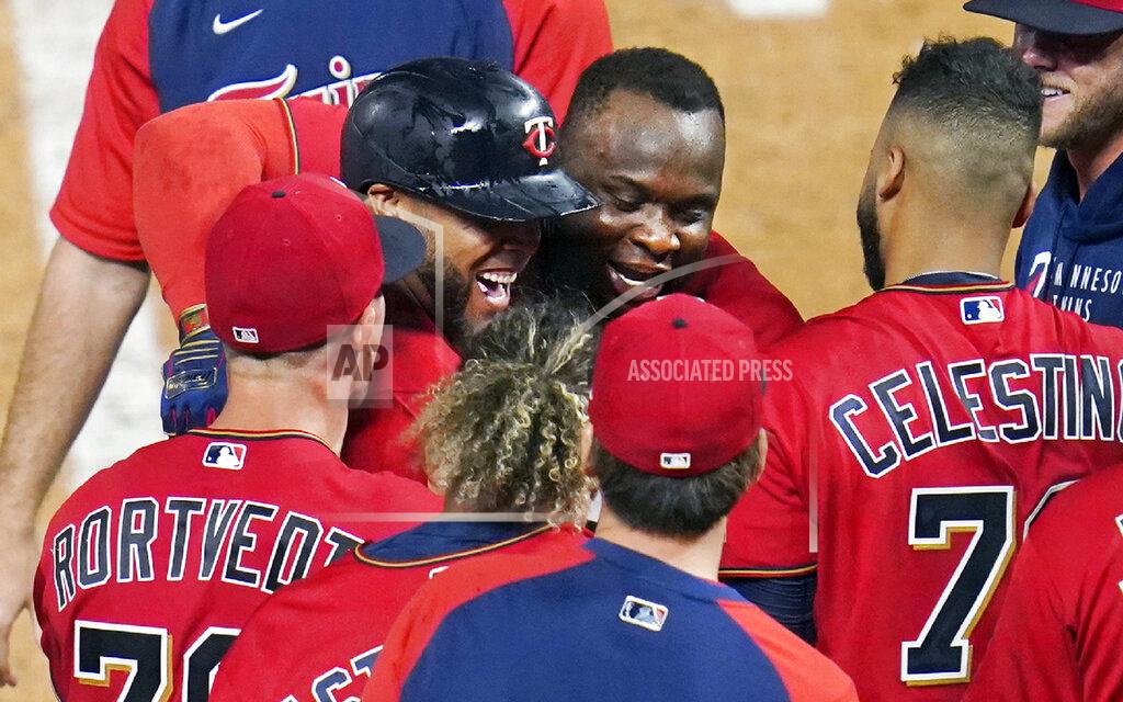 Jim Mone Minnesota Twins' Miguel Sano, center hugs Nelson Cruz after Cruz's two-run home run off New York Yankees relief pitcher Aroldis Chapman during the ninth inning of a baseball game Thursday, June 10, 2021, in Minneapolis. The Twins won 7-5. (AP Photo/Jim Mone)