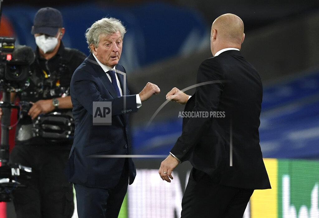Daniel Leal-Olivas Crystal Palace's manager Roy Hodgson, left, congratulates Burnley's manager Sean Dyche following the English Premier League soccer match between Crystal Palace and Burnley at Selhurst Park, in London, England, Monday, June 29, 2020. Burnley defeated Crystal Palace 1-0. (AP Photo/Daniel Leal-Olivas,Pool)