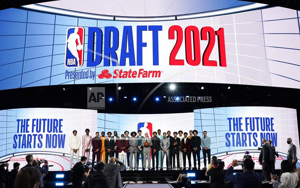 Corey Sipkin NBA Commissioner Adam Silver, center, poses for a photo with players projected to be first-round draft picks before the NBA basketball draft, Thursday, July 29, 2021, in New York. (AP Photo/Corey Sipkin)