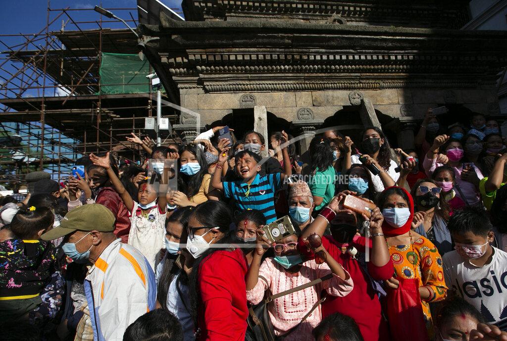 Niranjan Shrestha Nepalese devotees gather to watch the annual Indra Jatra festival in Kathmandu, Nepal, Sunday, Sept. 19, 2021. The feast of Indra Jatra marks the return of the festival season in the Himalayan nation two years after it was scaled down because the pandemic. (AP Photo/Niranjan Shrestha)