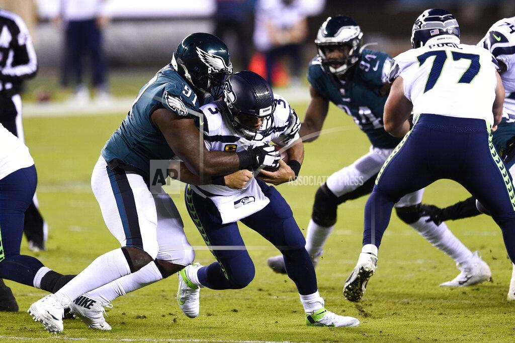 Derik Hamilton Philadelphia Eagles' Fletcher Cox (91) tackles Seattle Seahawks' Russell Wilson (3) during the first half of an NFL football game, Monday, Nov. 30, 2020, in Philadelphia. (AP Photo/Derik Hamilton)