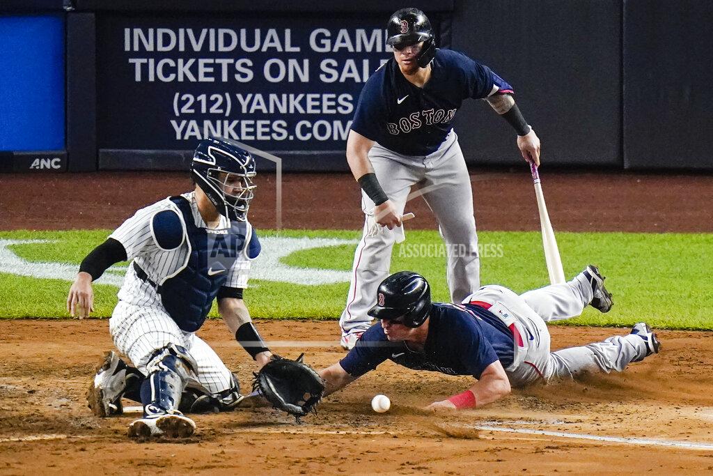 Frank Franklin Ii Boston Red Sox's Christian Vazquez, top right, watches as Hunter Renfroe, bottom right, slides past New York Yankees catcher Gary Sanchez, left, to score on a double by Red Sox's Marwin Gonzalez during the sixth inning of a baseball game Friday, June 4, 2021, in New York. (AP Photo/Frank Franklin II)