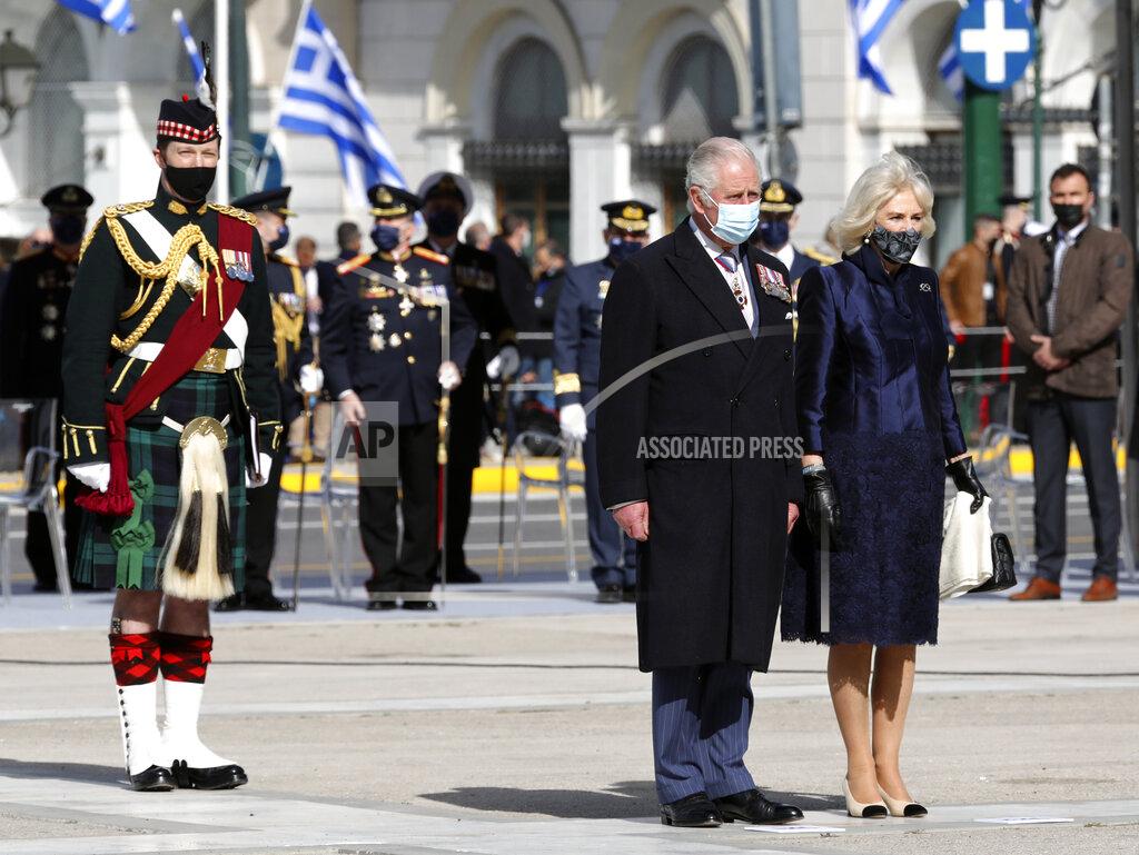 Yorgos Karahalis Britain's Prince Charles, front left, and his wife Camilla, the Duchess of Cornwall arrive to lay a wreath at the tomb of the Unknown Soldier in Athens, Thursday, March 25, 2021. Greece celebrates the bicentenary of the start of the country's war of independence against the Ottoman Empire. (AP Photo/Yorgos Karahalis)