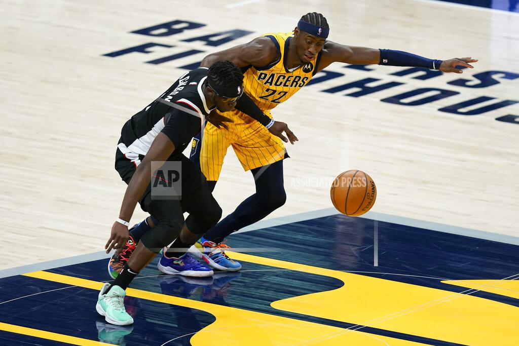 Darron Cummings Los Angeles Clippers' Reggie Jackson (1) is fouled by Indiana Pacers' Caris LeVert (22) during the second half of an NBA basketball game, Tuesday, April 13, 2021, in Indianapolis. (AP Photo/Darron Cummings)