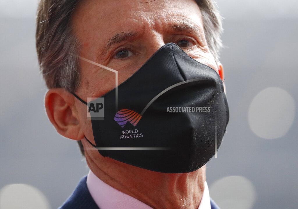 Issei Kato World Athletics President Sebastian Coe wearing a protective face mask inspects at the National Stadium, the main stadium of Tokyo 2020 Olympics and Paralympics, in Tokyo Thursday, Oct. 8, 2020. (Issei Kato/Pool Photo via AP)