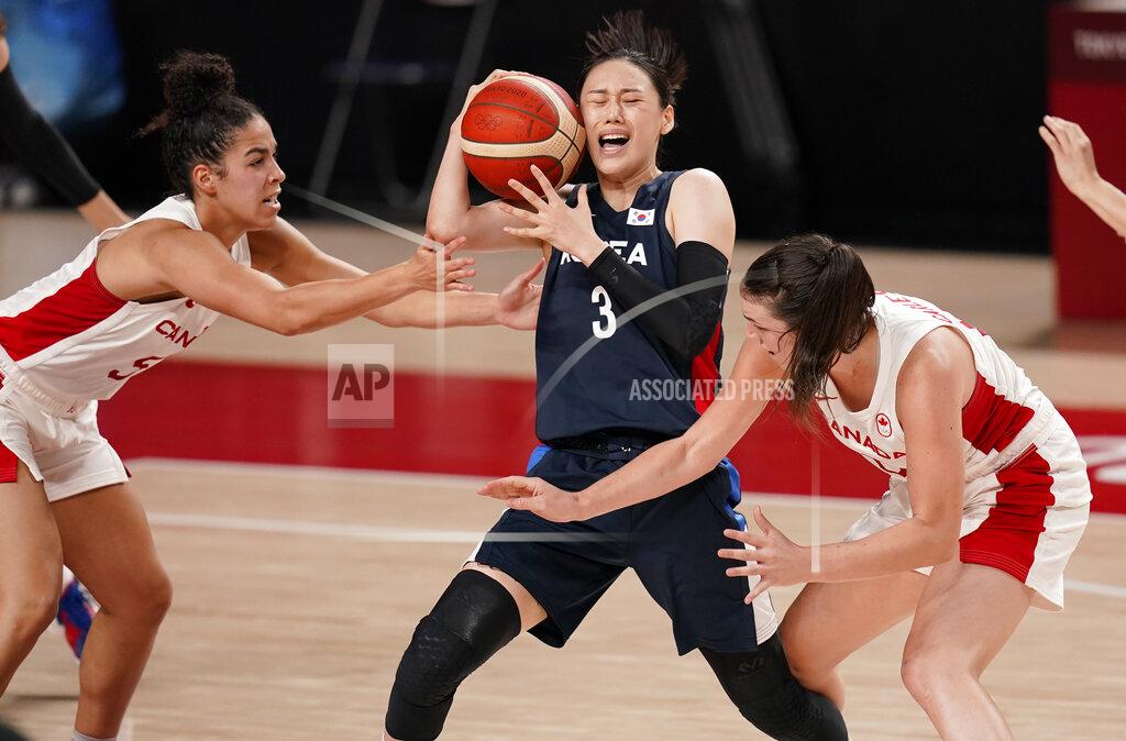 Charlie Neibergall South Korea's Leeseul Kang (3), center, drives between Canada's Kia Nurse (5) and Bridget Carleton (6) during women's basketball preliminary round game at the 2020 Summer Olympics, Thursday, July 29, 2021, in Saitama, Japan. (AP Photo/Charlie Neibergall)