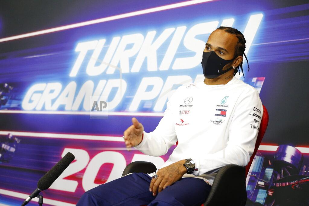 Antonin Vincent Mercedes driver Lewis Hamilton of Britain talks during a press conference at the Istanbul Park circuit racetrack in Istanbul, Thursday, Nov. 12, 2020, ahead of the Formula One Turkish Grand Prix that will take place on Sunday. (Antonin Vincent/Pool via AP)