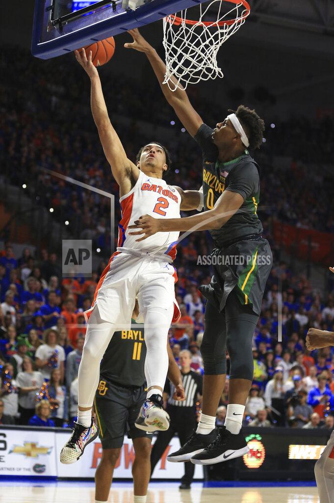 Matt Stamey Florida guard Andrew Nembhard (2) makes a shot past Baylor forward Flo Thamba (0) during the first half of an NCAA college basketball game Saturday, Jan. 25, 2020, in Gainesville, Fla. (AP Photo/Matt Stamey)