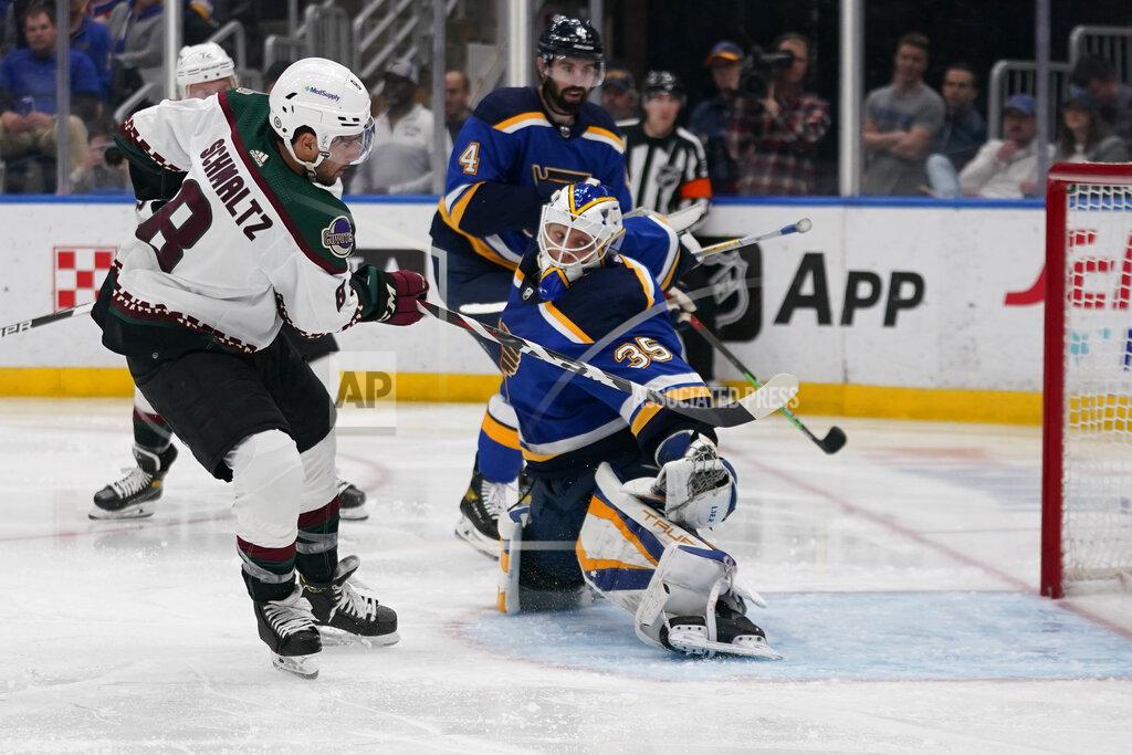 Jeff Roberson Arizona Coyotes' Nick Schmaltz (8) scores past St. Louis Blues goaltender Ville Husso (35) during the third period of an NHL hockey game Monday, April 4, 2022, in St. Louis. (AP Photo/Jeff Roberson)