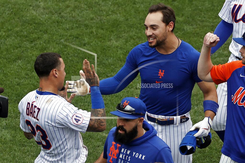 Adam Hunger New York Mets' Michael Conforto celebrates with Javier Baez after defeating the Miami Marlins in the first game of a baseball doubleheader that started April 11 and was suspended because of rain, Tuesday, Aug. 31, 2021, in New York. The Mets won 6-5. (AP Photo/Adam Hunger)