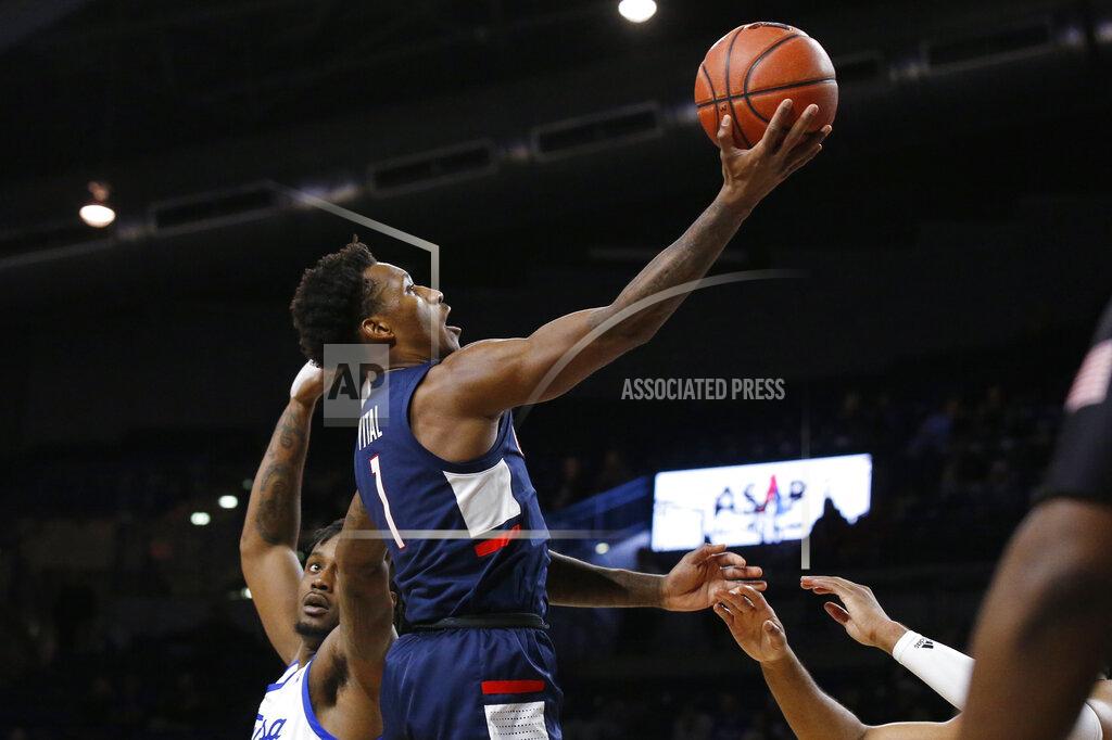 Sue Ogrocki Connecticut guard Christian Vital (1) goes to the basket in front of Tulsa forward Martins Igbanu, left, during the first half of an NCAA college basketball game in Tulsa, Okla., Thursday, Feb. 6, 2020. (AP Photo/Sue Ogrocki)