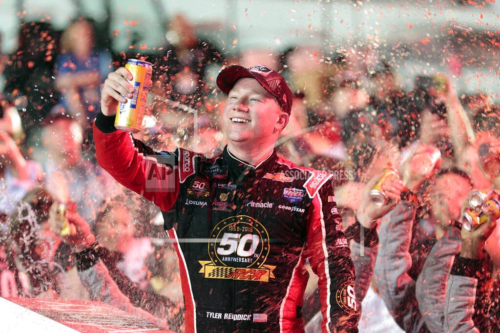 Luis M. Alvarez Tyler Reddick celebrates in Victory Lane after winning the NASCAR Xfinity Series auto racing championship at Homestead-Miami Speedway in Homestead, Fla. Saturday, Nov. 16, 2019. (AP Photo/Luis M. Alvarez)