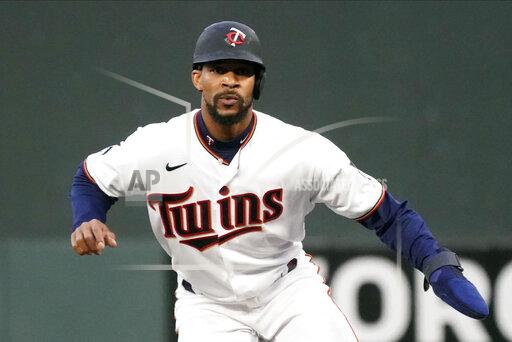 FILE -Minnesota Twins' Byron Buxton takes a lead at first base against the Toronto Blue Jays in a baseball game, Thursday, Sept. 23, 2021, in Minneapolis. The Minnesota Twins and center fielder Byron Buxton have agreed to a seven-year, $100 million contract, according to a person with knowledge of the deal, Sunday Nov. 28, 2021. (AP Photo/Jim Mone, File)
