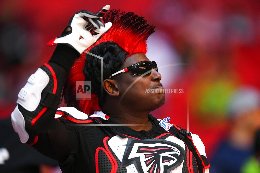 John Amis An Atlanta Falcons fan cheers during the first half of an NFL football game against the Seattle Seahawks, Sunday, Oct. 27, 2019, in Atlanta. (AP Photo/John Amis)