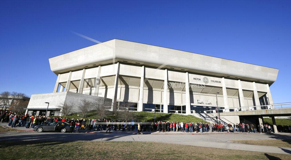 Charlie Neibergall FILE - In this Dec. 10, 2015, file photo, Iowa State students stand in line outside Hilton Coliseum before an NCAA college basketball game between Iowa State and Iowa, in Ames, Iowa. Iowa State President Wendy Wintersteen has transferred oversight of the Iowa State Center, a series of buildings near Hilton Coliseum and Jack Trice Stadium, to the athletic department. It has also tabbed athletic director Jamie Pollard to be the head of a process to redesign the area as an “arts, culture, and community district.” The school announced the plan on Tuesday, Sept. 17, 2019, saying that Pollard and Iowa State Research Park President Rick Sanders will lead a feasibility study to build a multi-use development district between Hilton and Jack Trice _ which is now largely just parking lots. (AP Photo/Charlie Neibergall, File)