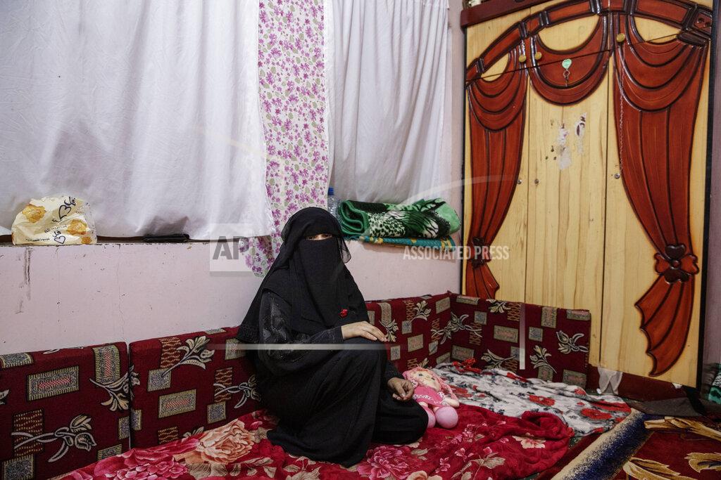 Nariman El-Mofty FILE - In this June 19, 2021 file photo, Gamila Salih Ali, mother of two-year-old Liyan Taher, and wife of 32-year-old Taher Farag, who were both killed in a ballistic missile and an explosive-laden drone fired by Yemen's Houthi rebels sits near her daughters toy at their home in Marib, Yemen. The United Nations said Tuesday, Oct. 19, 2021 that more than 10,000 children in Yemen have now been killed or injured in violence linked to years of war in the impoverished country. The children’s agency UNICEF said the verified tally is surely an undercount of the real toll. (AP Photo/Nariman El-Mofty)