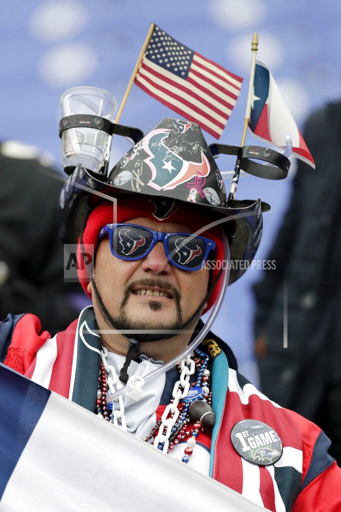 Julio Cortez Daniel Flores, of Houston, looks on as players work out prior to an NFL football game between the Baltimore Ravens and the Houston Texans, Sunday, Nov. 17, 2019, in Baltimore. (AP Photo/Julio Cortez)
