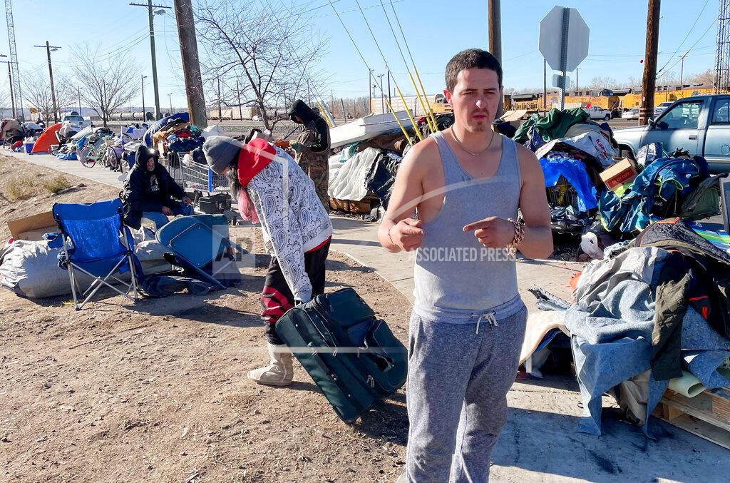 Tim Vandenack Jacob Garcia-Rader, resident of a tent city encampment on 33rd Street speaks Tuesday, Dec. 1, 2020, in Ogden, Utah. (Tim Vandenack/Standard-Examiner via AP)