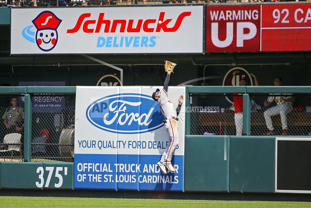 Scott Kane San Francisco Giants right fielder Luis Gonzalez (51) is unable to catch a solo home run hit by St. Louis Cardinals' Tommy Edman during the fifth inning of a baseball game Saturday, May 14, 2022, in St. Louis. (AP Photo/Scott Kane)