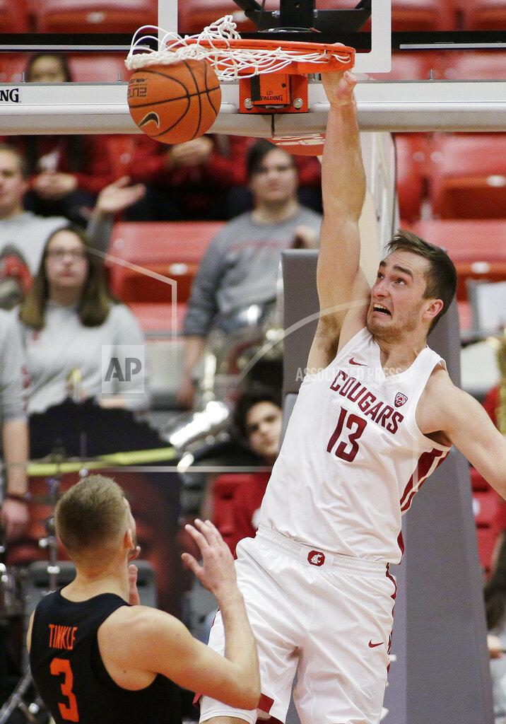 Young Kwak Washington State forward Jeff Pollard (13) dunks during the first half of an NCAA college basketball game against Oregon State in Pullman, Wash., Saturday, March 9, 2019. (AP Photo/Young Kwak)