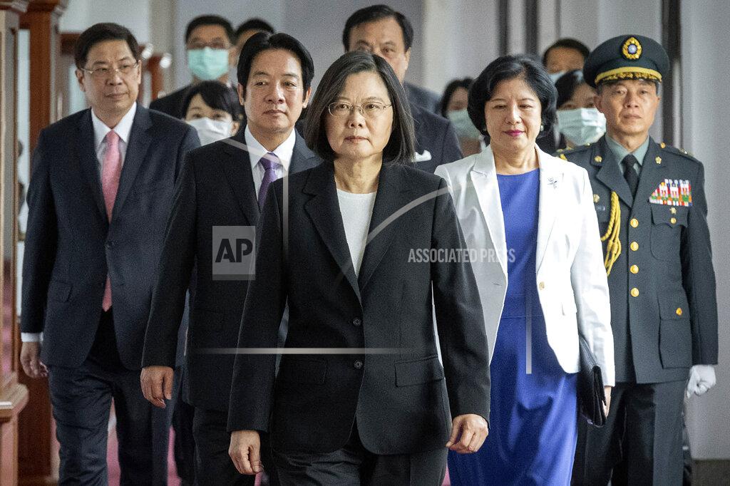 Uncredited In this photo released by the Taiwan Presidential Office, Taiwanese President Tsai Ing-wen, center, walks ahead of Vice-President Lai Ching-te, left of her, as they attend an inauguration ceremony in Taipei, Taiwan, Wednesday, May 20, 2020. Tsai was inaugurated for a second term amid increasing pressure from China on the self-governing island democracy it claims as its own territory. (Taiwan Presidential Office via AP)