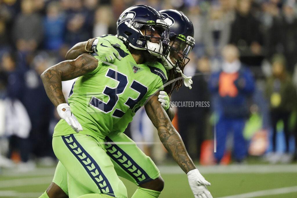 Elaine Thompson Seattle Seahawks' Tedric Thompson (33) celebrates with cornerback Shaquill Griffin after Thompson intercepted a Los Angeles Rams pass during the second half of an NFL football game Thursday, Oct. 3, 2019, in Seattle. (AP Photo/Elaine Thompson)