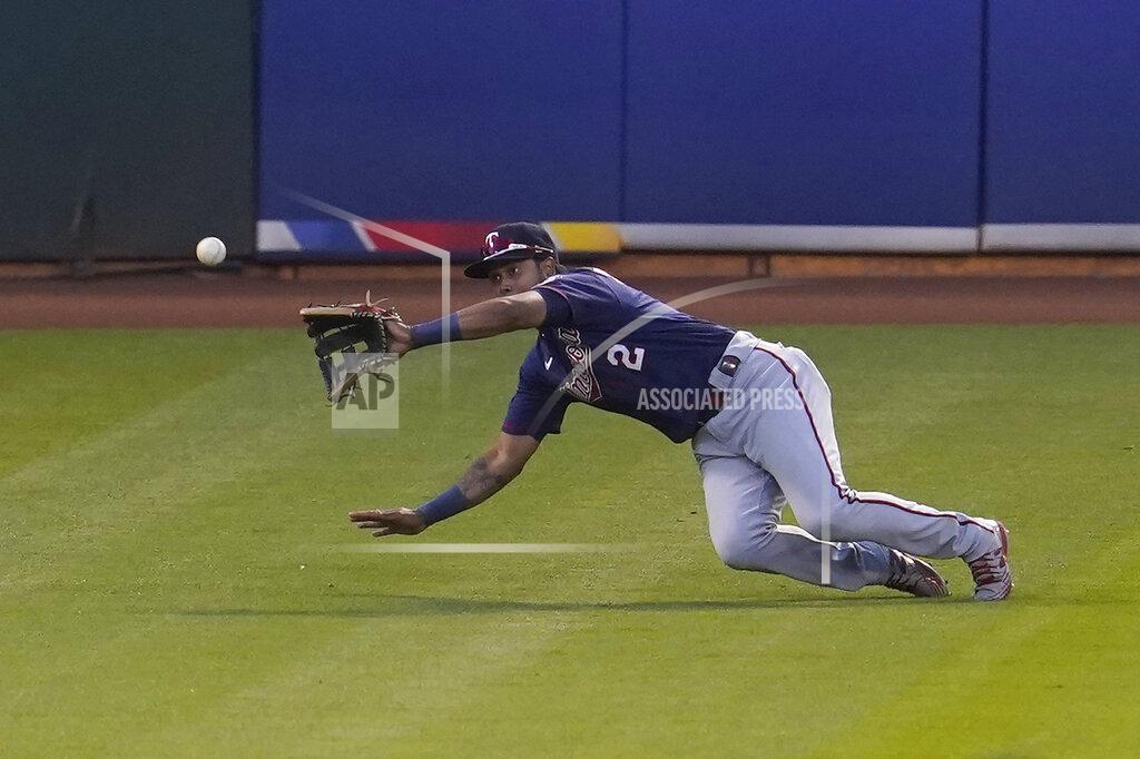 Jeff Chiu Minnesota Twins left fielder Luis Arraez catches a line out hit by Oakland Athletics' Elvis Andrus before doubling up Mitch Moreland at second base during the fourth inning of the second baseball game of a doubleheader in Oakland, Calif., Tuesday, April 20, 2021. (AP Photo/Jeff Chiu)