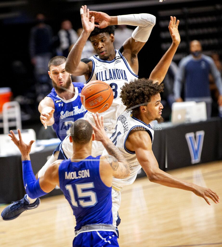 Laurence Kesterson Seton Hall forward Sandro Mamukelashvili, rear, passes the ball to guard Takal Molson (15) under the basket as Villanova forwards Brandon Slater (3) and Jeremiah Robinson-Earl (24) defend during the second half of an NCAA college basketball game Tuesday, Jan. 19, 2021, in Villanova, Pa. (AP Photo/Laurence Kesterson)