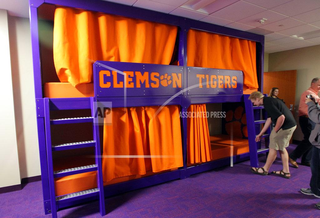 Ken Ruinard In this Jan. 31, 2017 photo, members of the media look over a nap room inside the Clemson Football Facility at Clemson University in Clemson, S.C. When it comes to facilities in the ACC, Clemson has set the standard. The Tigers opened a $55 million team headquarters two years ago that includes a miniature golf course, a slide and a nap room. With the team pursuing its fourth straight ACC title and College Football Playoff berth, they feel the investment is paying off. (Ken Ruinard/The Independent-Mail via AP)