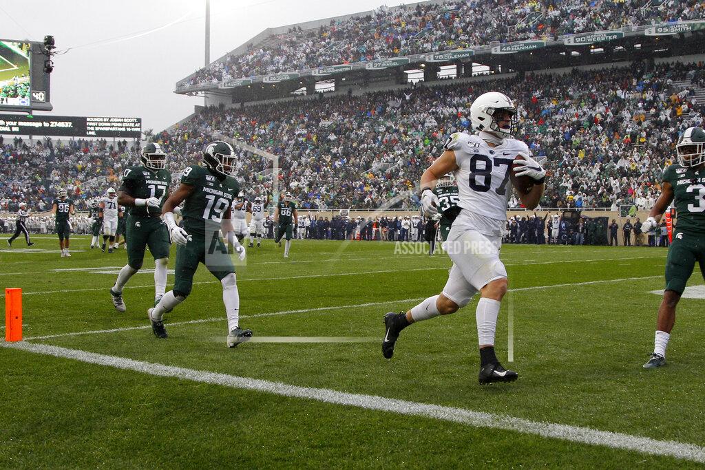 Al Goldis Penn State's Pat Freiermuth (87) runs in for a touchdown on a pass reception against Michigan State's Josh Butler (19), Tre Mosley (17) and Xavier Henderson, right, during the first quarter of an NCAA college football game, Saturday, Oct. 26, 2019, in East Lansing, Mich. (AP Photo/Al Goldis)
