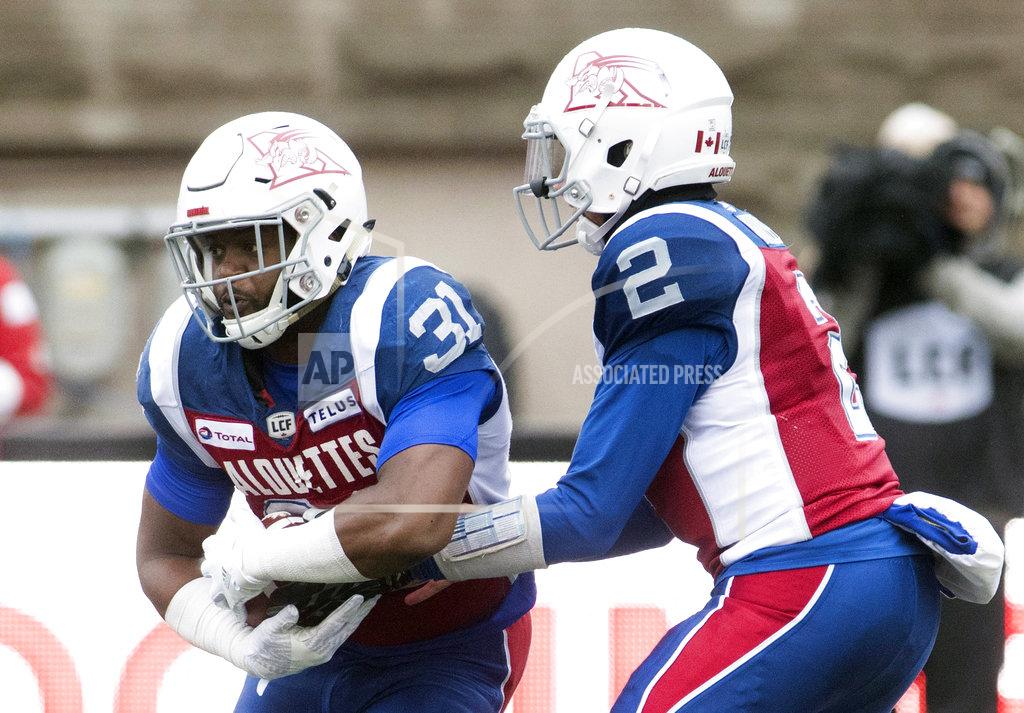 Graham Hughes Montreal Alouettes quarterback Johnny Manziel (2) hands off to William Stanback during first-half CFL football game action against the Toronto Argonauts in Montreal, Sunday, Oct. 28, 2018. (Graham Hughes/The Canadian Press via AP)