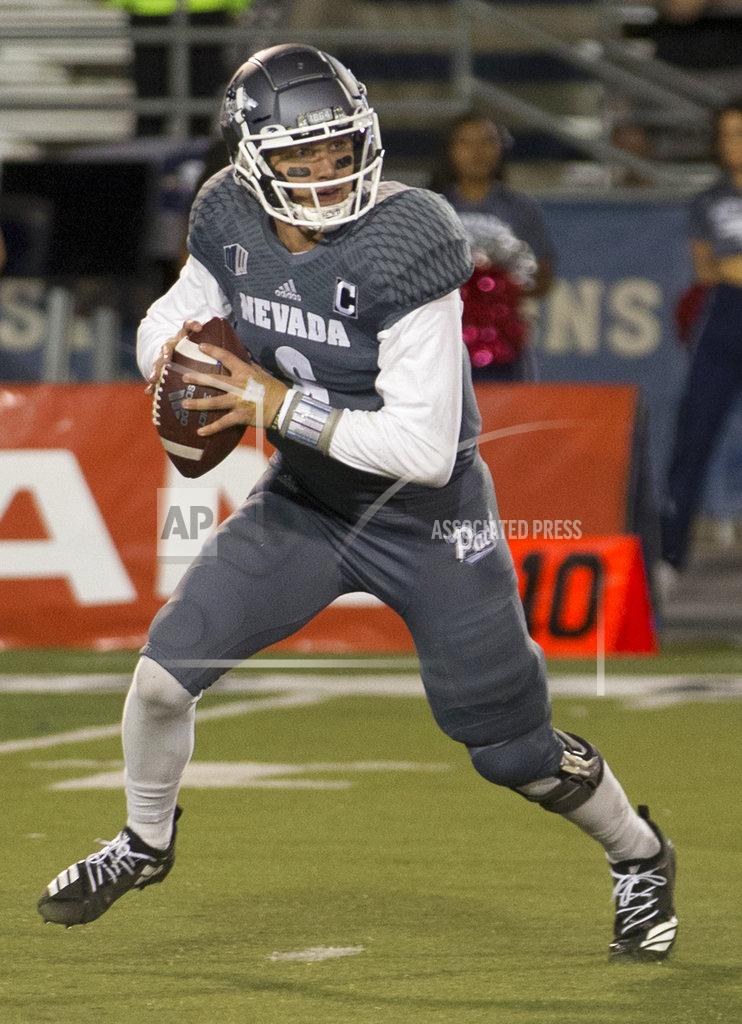 Tom R. Smedes Nevada quarterback Ty Gangi (6) rolls out against San Diego State in the second half of an NCAA college football game in Reno, Nev., Saturday, Oct. 27, 2018. (AP Photo/Tom R. Smedes)