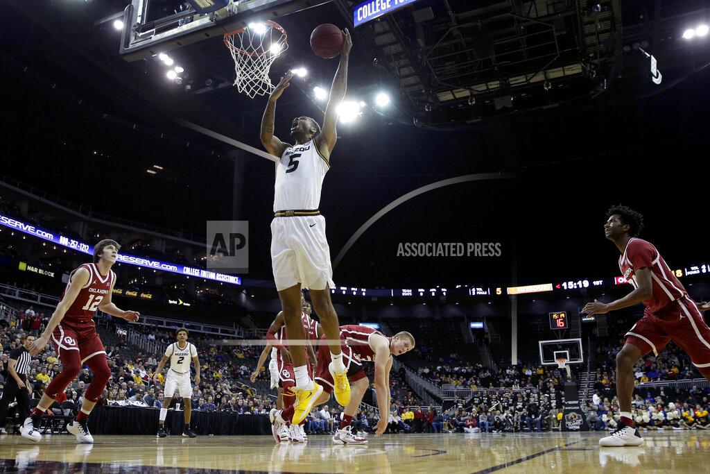 Charlie Riedel Missouri forward Mitchell Smith (5) shoots during the first half of an NCAA college basketball game against Oklahoma, Tuesday, Nov. 26, 2019, in Kansas City, Mo. (AP Photo/Charlie Riedel)