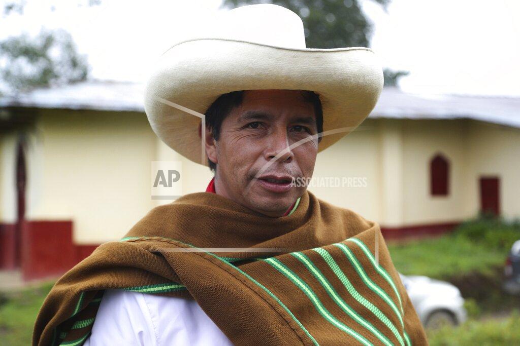 Martin Mejia Free Peru party presidential candidate Pedro Castillo poses for a photo on his land in Chugur, Peru, Friday, April 16, 2021. Castillo, a rural teacher, who has proposed rewriting Peru's constitution and deporting all immigrants living in the country illegally who commit crimes, will face rival candidate Keiko Fujimori in the June 6 presidential run-off election. (AP Photo/Martin Mejia)