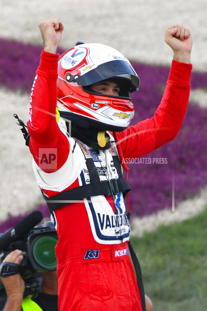 John Amis Kyle Larson celebrates at the finish line after winning a NASCAR Cup Series auto race Sunday, June 20, 2021, in Lebanon, Tenn. (AP Photo/John Amis)